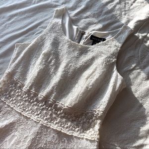 White lace-covered dress